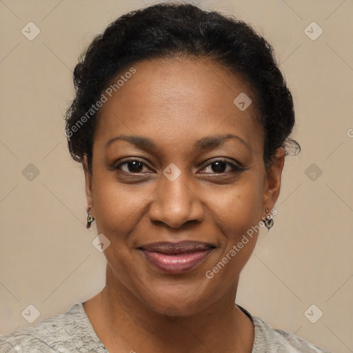 Joyful black adult female with short  brown hair and brown eyes