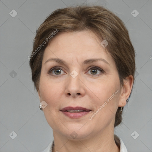 Joyful white adult female with medium  brown hair and grey eyes