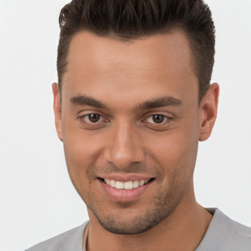 Joyful white young-adult male with short  brown hair and brown eyes