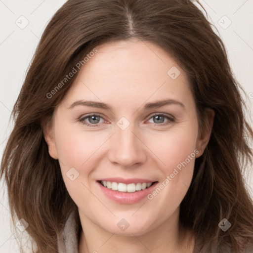 Joyful white young-adult female with long  brown hair and grey eyes