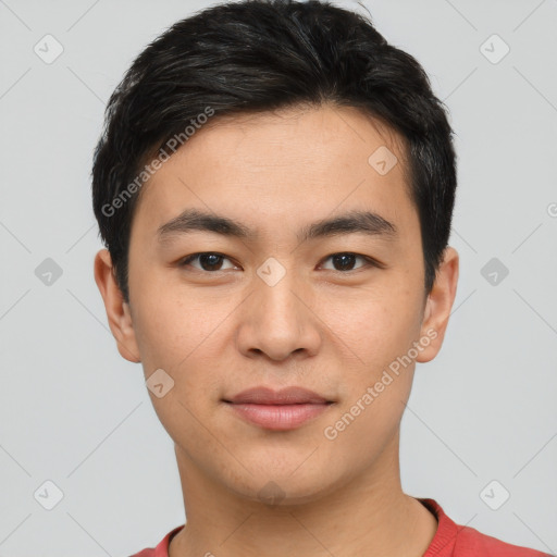 Joyful white young-adult male with short  black hair and brown eyes