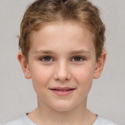 Joyful white child female with short  brown hair and brown eyes