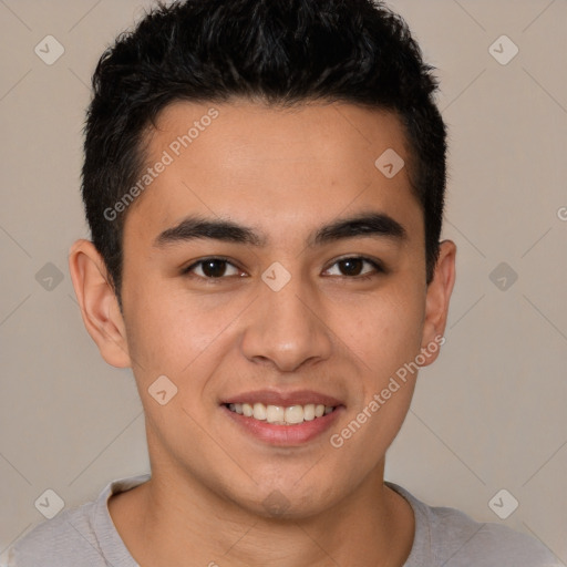 Joyful latino young-adult male with short  brown hair and brown eyes