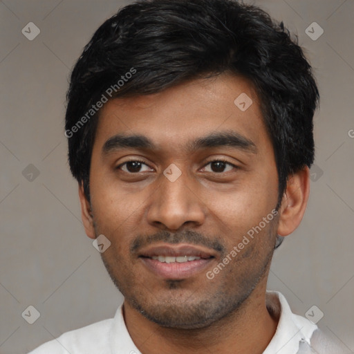 Joyful black young-adult male with short  black hair and brown eyes