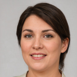 Joyful white young-adult female with medium  brown hair and brown eyes