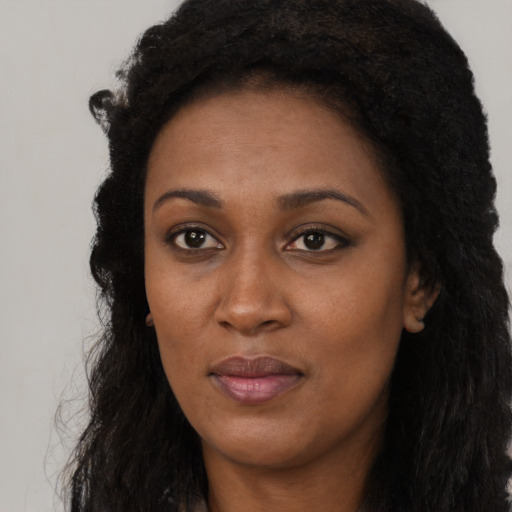 Neutral black young-adult female with long  black hair and brown eyes
