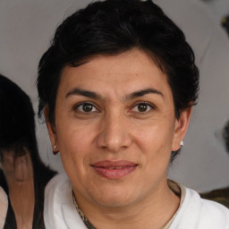 Joyful white adult female with short  brown hair and brown eyes