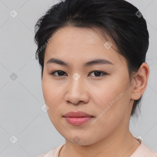 Joyful asian young-adult female with medium  brown hair and brown eyes