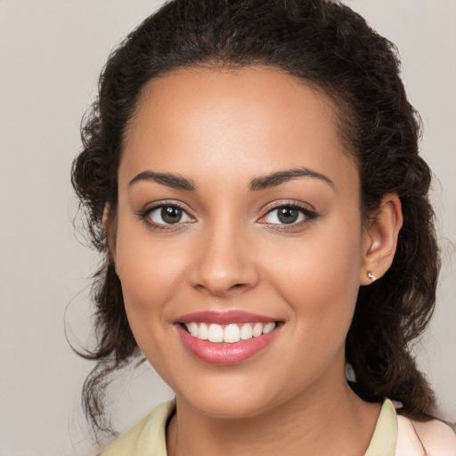 Joyful white young-adult female with long  brown hair and brown eyes