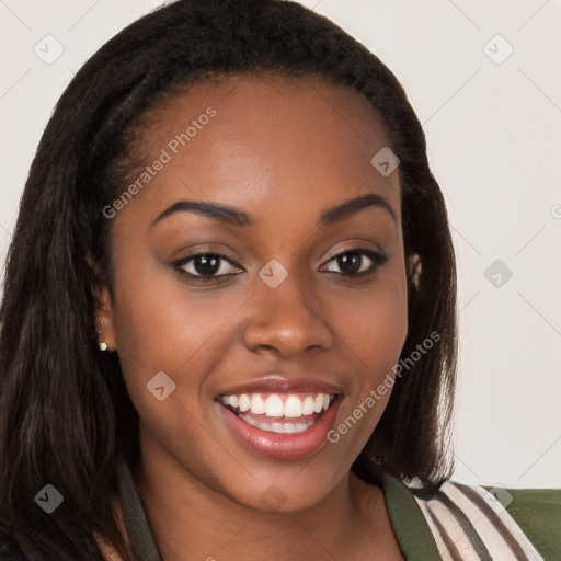 Joyful black young-adult female with long  brown hair and brown eyes