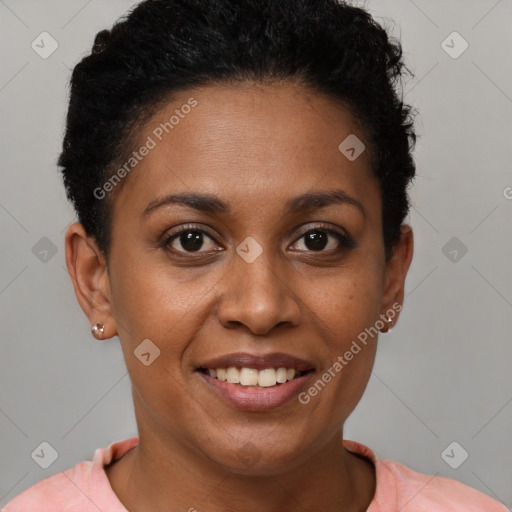 Joyful black young-adult female with short  brown hair and brown eyes