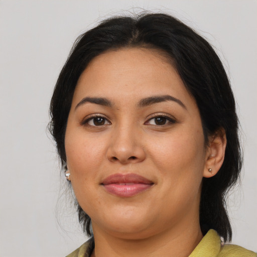 Joyful white young-adult female with medium  black hair and brown eyes