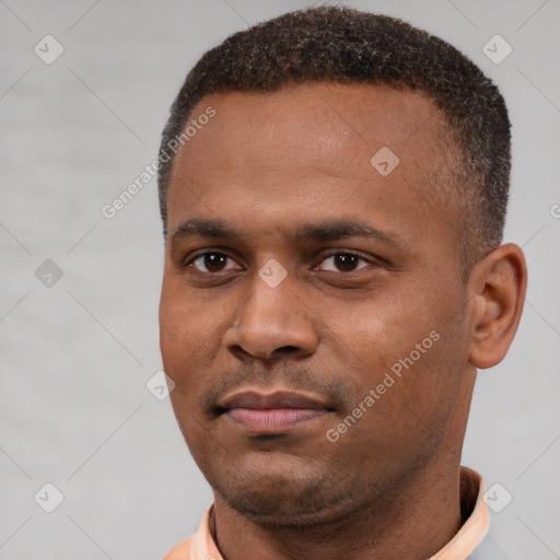 Neutral black young-adult male with short  black hair and brown eyes