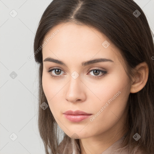 Neutral white young-adult female with long  brown hair and brown eyes