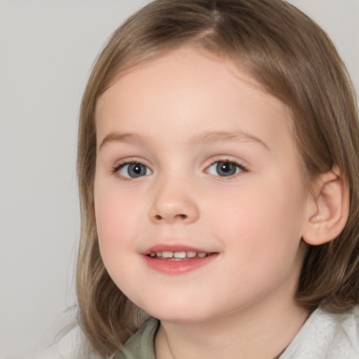 Joyful white child female with medium  brown hair and brown eyes