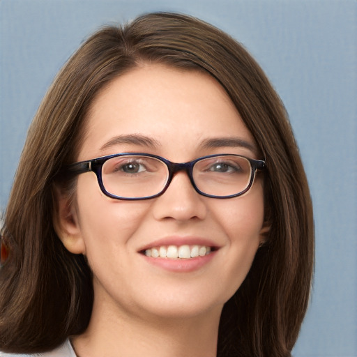 Joyful white young-adult female with long  brown hair and blue eyes