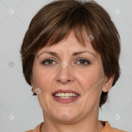 Joyful white adult female with medium  brown hair and grey eyes