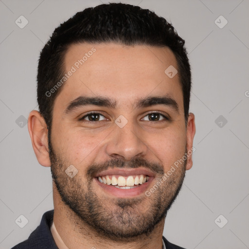 Joyful white young-adult male with short  black hair and brown eyes