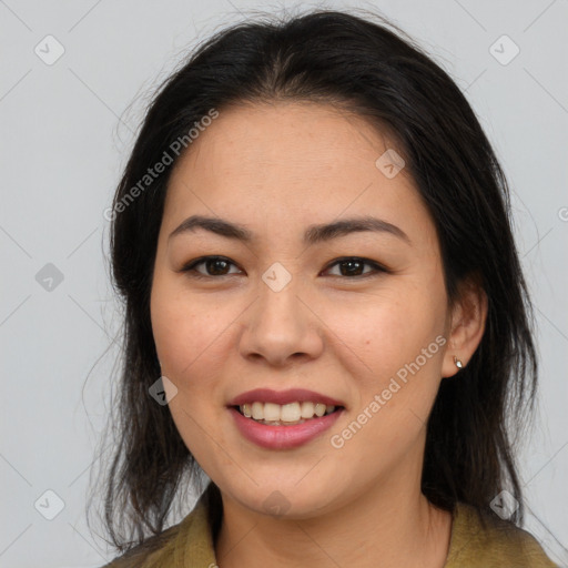 Joyful asian young-adult female with long  brown hair and brown eyes