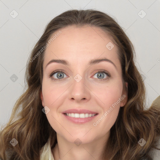 Joyful white young-adult female with long  brown hair and blue eyes