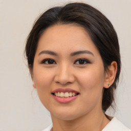 Joyful asian young-adult female with medium  brown hair and brown eyes