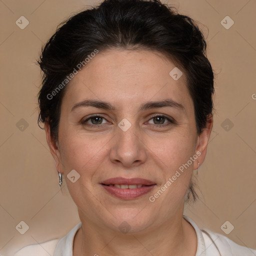 Joyful white adult female with short  brown hair and brown eyes