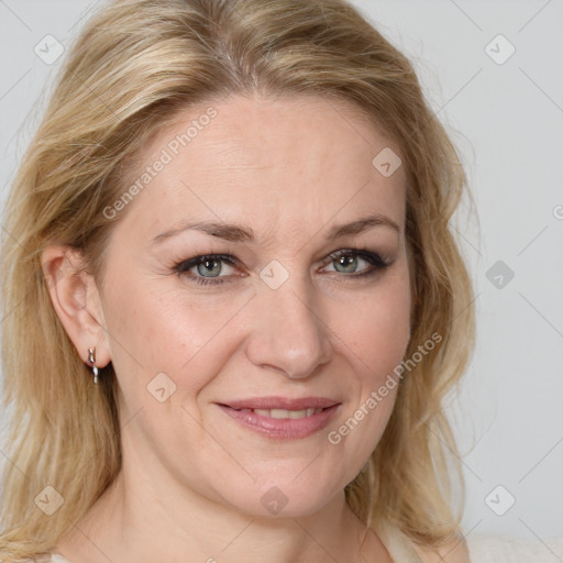 Joyful white adult female with medium  brown hair and blue eyes