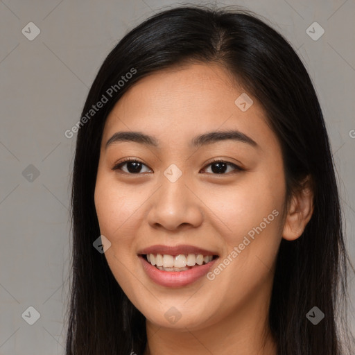 Joyful asian young-adult female with long  brown hair and brown eyes