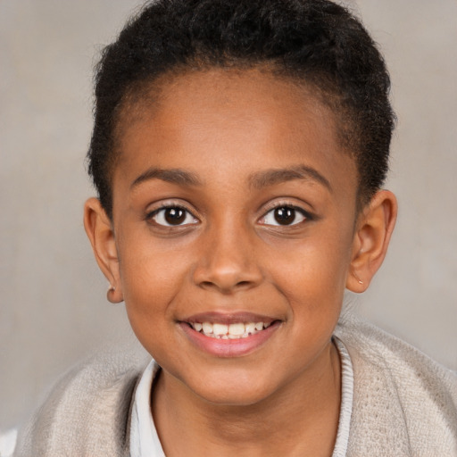 Joyful black child female with short  brown hair and brown eyes