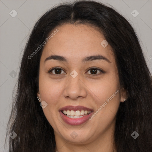 Joyful latino young-adult female with long  brown hair and brown eyes