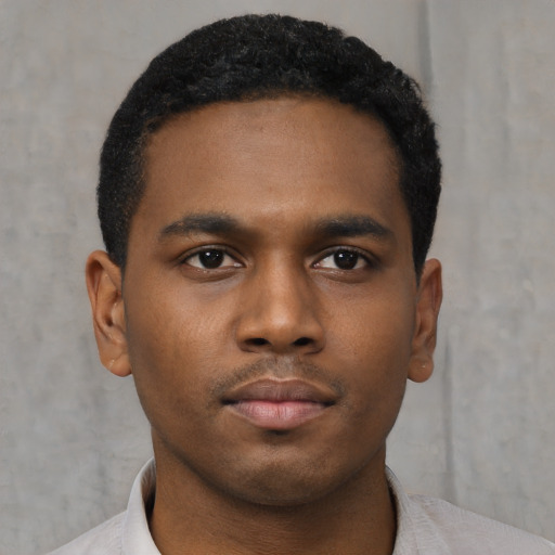 Neutral black young-adult male with short  black hair and brown eyes