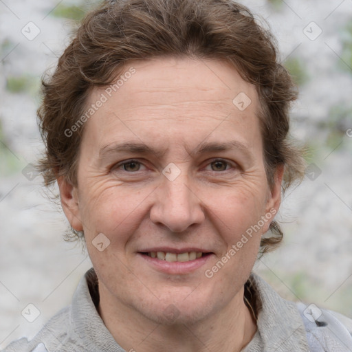 Joyful white adult female with short  brown hair and grey eyes