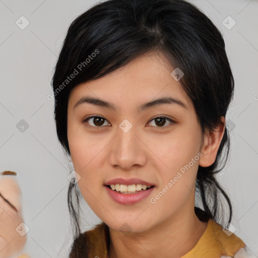 Joyful asian young-adult female with medium  black hair and brown eyes