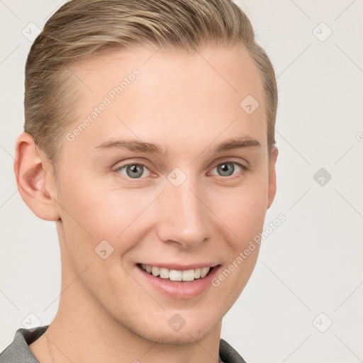 Joyful white young-adult female with short  brown hair and blue eyes