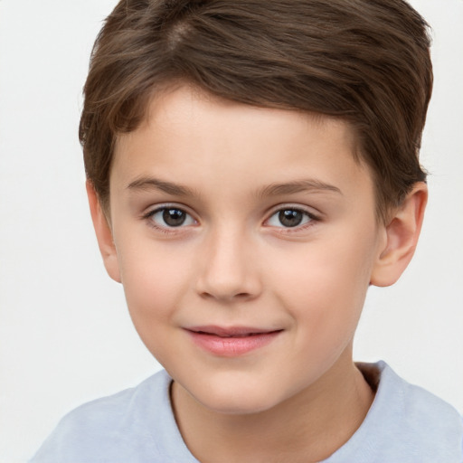 Joyful white child female with short  brown hair and brown eyes