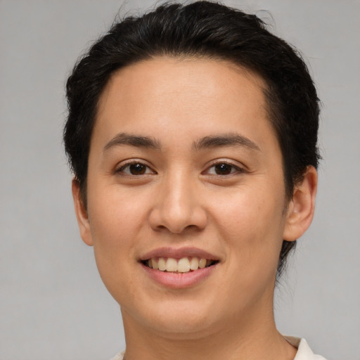 Joyful white young-adult female with short  brown hair and brown eyes