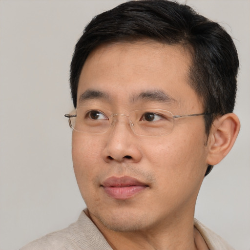 Neutral asian adult male with short  brown hair and brown eyes