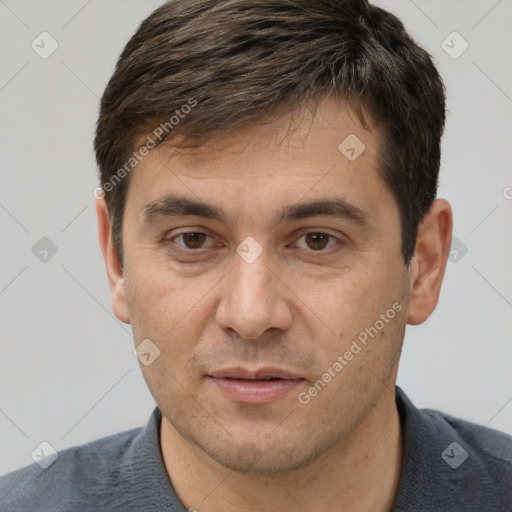 Joyful white adult male with short  brown hair and brown eyes