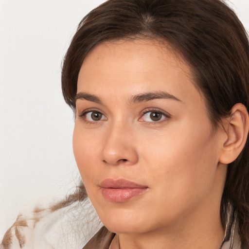 Neutral white young-adult female with long  brown hair and brown eyes