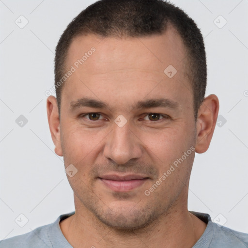 Joyful white young-adult male with short  brown hair and brown eyes