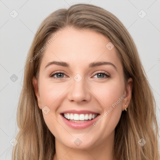 Joyful white young-adult female with long  brown hair and green eyes