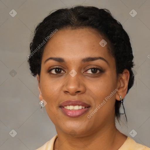 Joyful black adult female with short  brown hair and brown eyes
