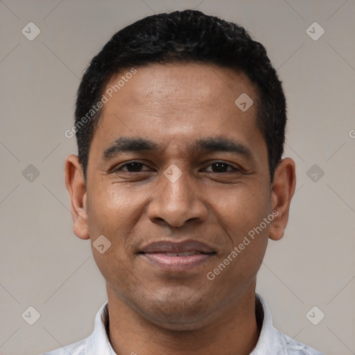 Joyful black young-adult male with short  black hair and brown eyes