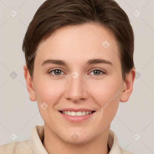 Joyful white young-adult female with short  brown hair and grey eyes