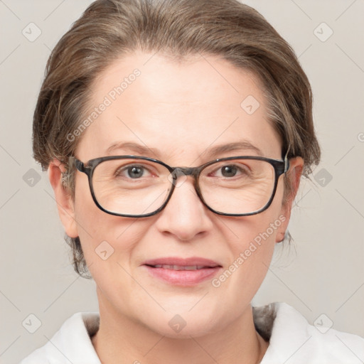 Joyful white adult female with medium  brown hair and brown eyes