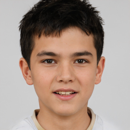Joyful white child male with short  brown hair and brown eyes