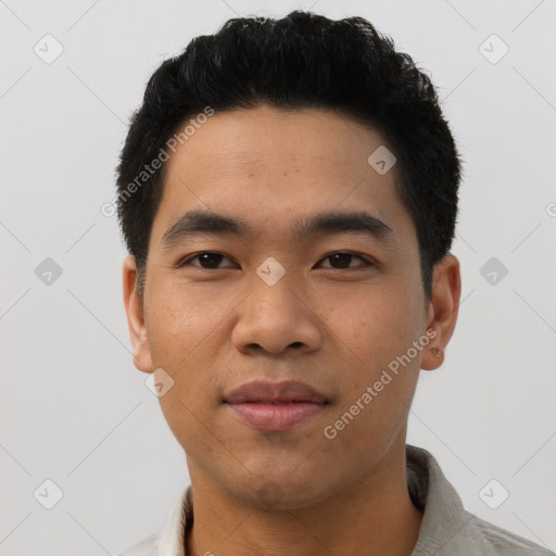 Joyful asian young-adult male with short  black hair and brown eyes