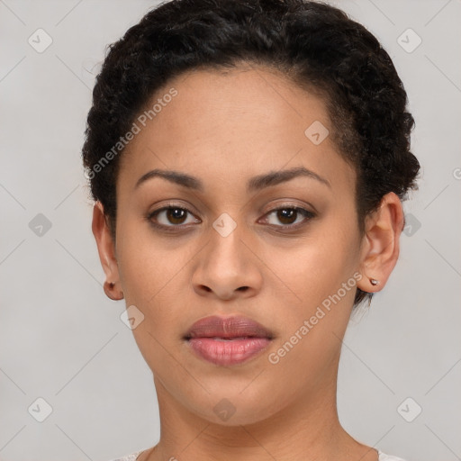 Joyful latino young-adult female with short  brown hair and brown eyes