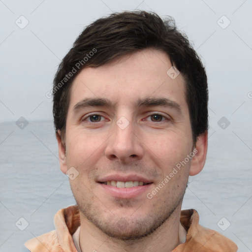 Joyful white young-adult male with short  brown hair and brown eyes