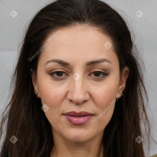 Joyful white adult female with long  brown hair and brown eyes